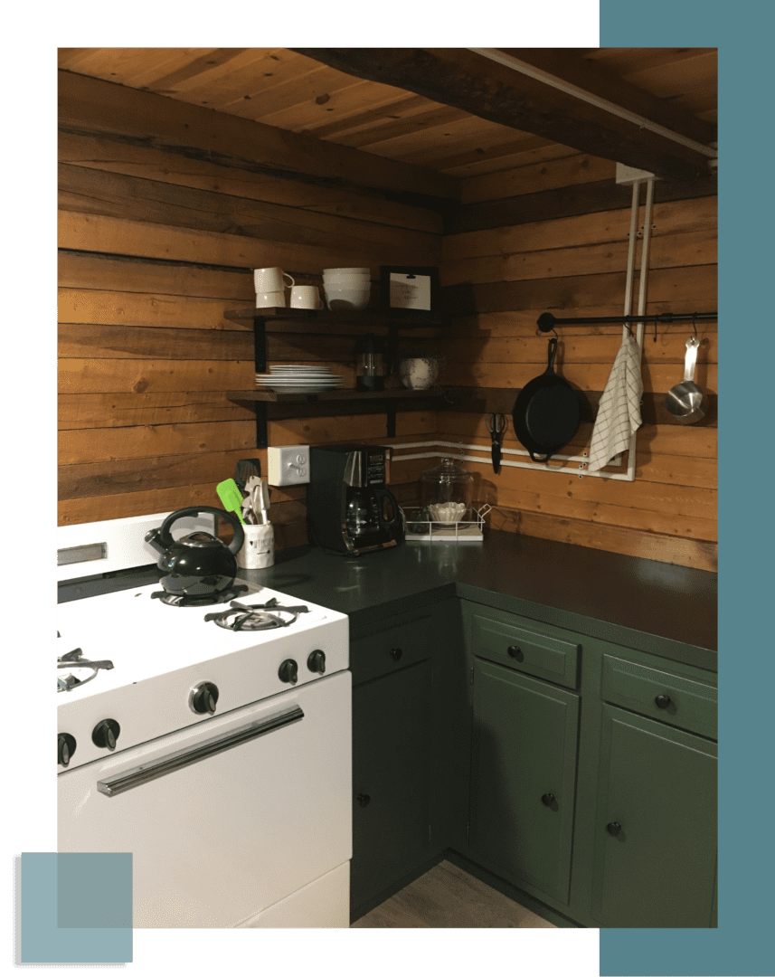 A kitchen with a stove and cabinets in it