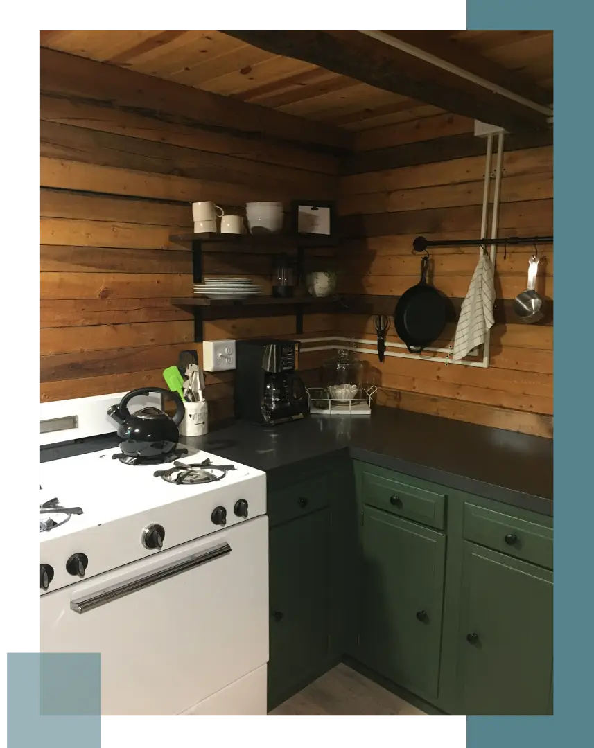 A kitchen with a stove and counter top.